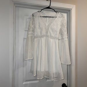 Cute white flowy v neck dress with cut out waist and flowy sleeves